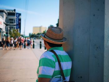 Rear view of man standing on street