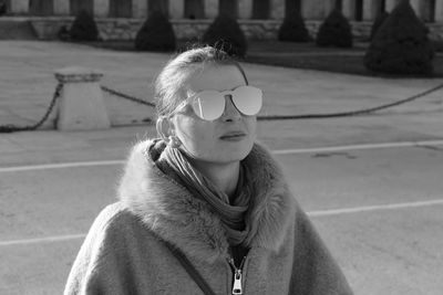Woman wearing warm clothing and sunglasses