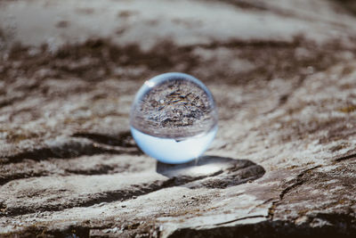 Close-up of crystal ball on table