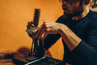 Close-up of worker working at workshop