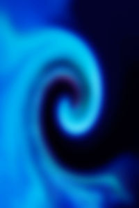 Full frame shot of illuminated blue light against black background
