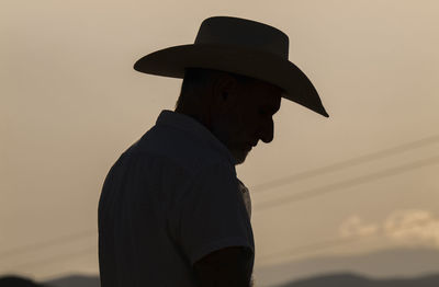 Silhouette of adult man in cowboy hat in desert during sunset. almeria, spain