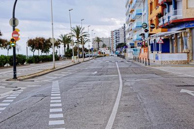 Road by city against sky