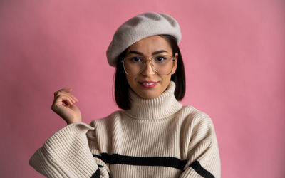 Portrait of smiling young woman wearing hat