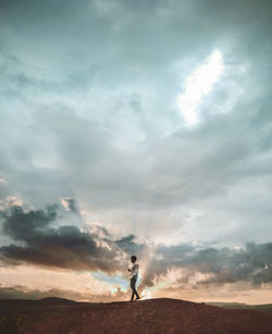 Full length of man standing on land against sky