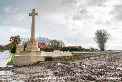 View of cemetery against cloudy sky