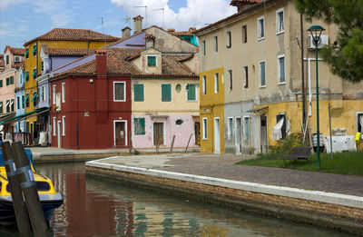 Colorful canal views in burano village, venice, italy