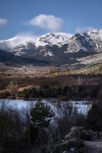 Scenic view of snowcapped mountains against sky