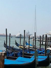 Boats moored at harbor