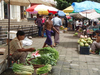 People at market stall