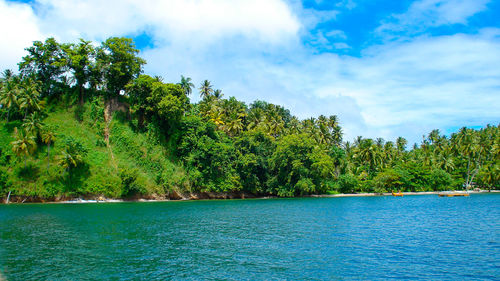 Scenic view of lake against cloudy sky