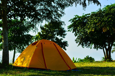 Tent on landscape against sky