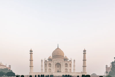 Taj mahal at foggy sunrise in winter