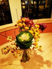 Close-up of flower vase on table at home