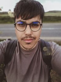 Portrait of man wearing eyeglasses