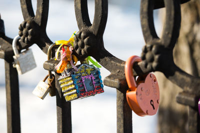 Close-up of padlocks hanging on metal
