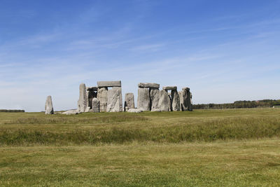 Built structure on field against sky