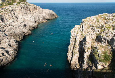 High angle view of rocks by sea