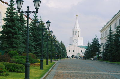 Street amidst buildings against sky