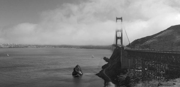Scenic view of bay bridge against sky