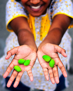 Person holding multi colored food