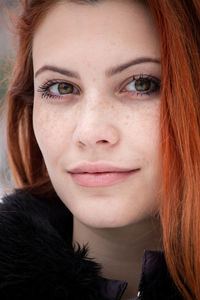 Close-up portrait of a smiling young woman