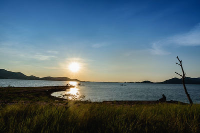 Scenic view of sunset over lake