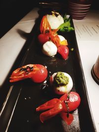 High angle view of vegetables in plate on table