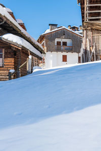 Winter magic. the ancient wooden houses of sauris di sopra. italy