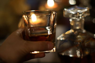 Close-up of hand holding wineglass