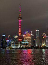 Illuminated buildings in city at night