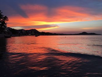Scenic view of sea against romantic sky at sunset