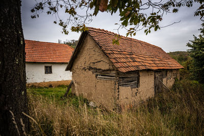 House on field against sky