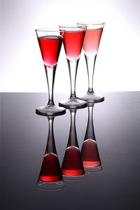 Alcohol in glass over white background