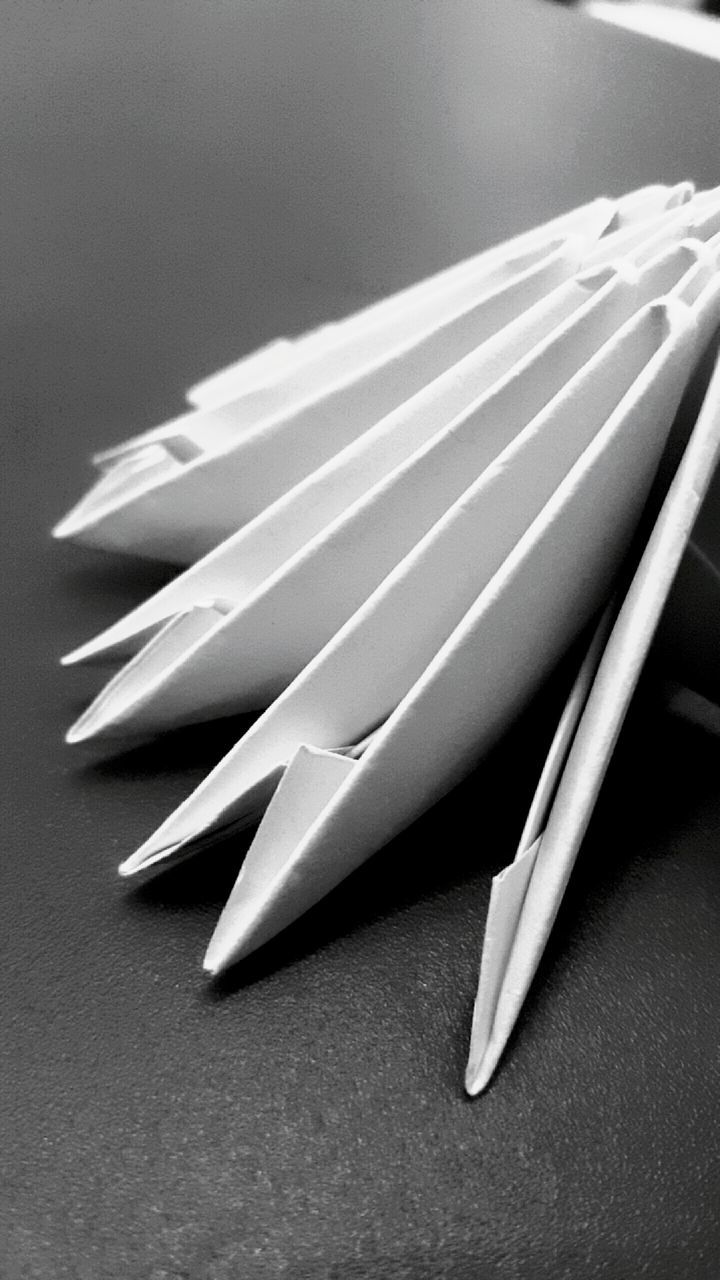 still life, indoors, close-up, paper, pencil, studio shot, education, table, book, pen, high angle view, white background, large group of objects, no people, in a row, arrangement, page, single object, white color, simplicity