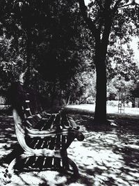 Empty chair against trees