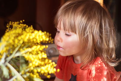 Close-up portrait of cute girl looking away