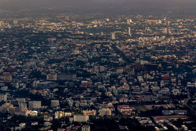 High angle view of illuminated buildings in city against sky