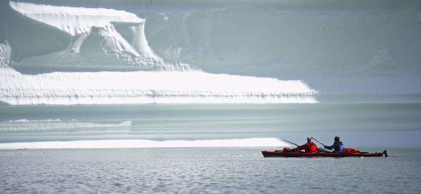 People in boat on sea