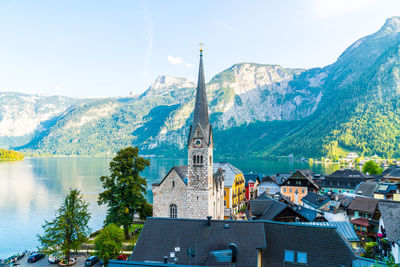 Panoramic view of buildings and mountains against sky