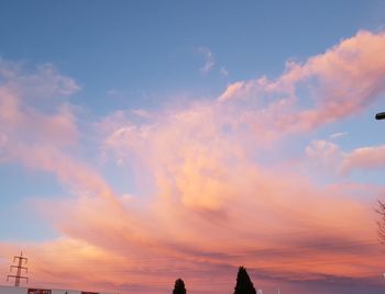 Low angle view of silhouette building against sky during sunset