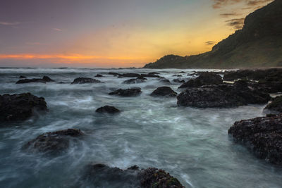 Scenic view of sea against sky during sunset