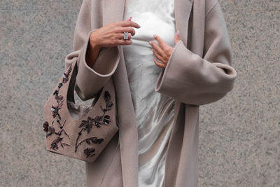 Midsection of woman holding gift