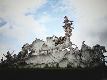 Low angle view of statue against sky