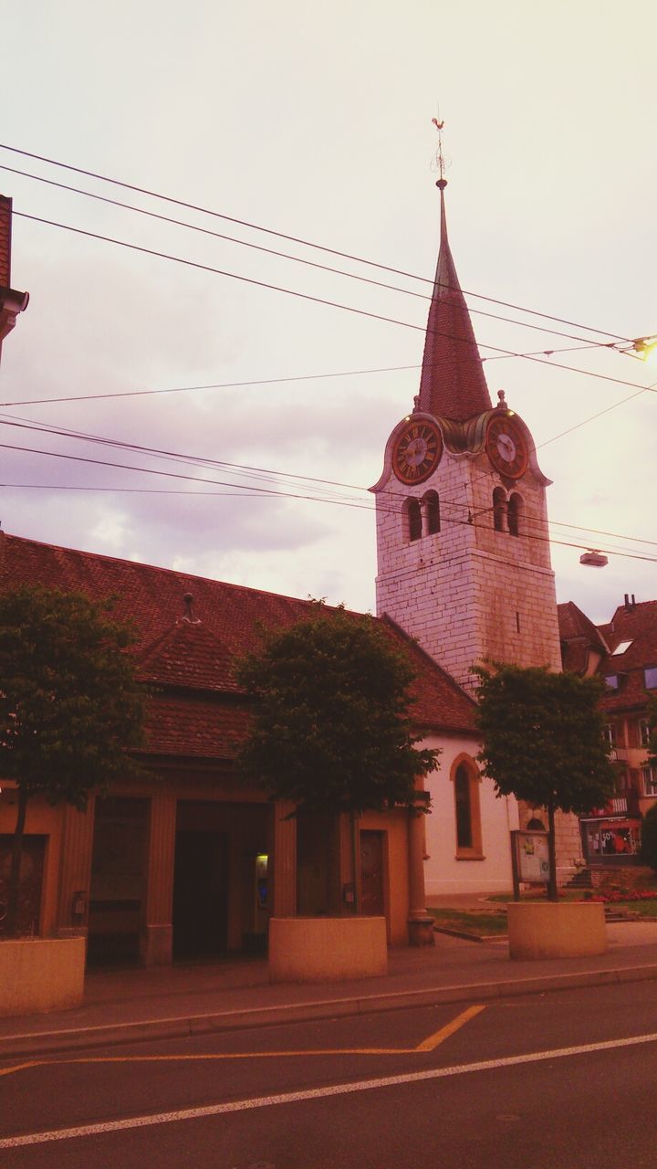 architecture, building exterior, built structure, religion, place of worship, church, spirituality, sky, cathedral, steeple, cross, history, roof, outdoors, tower, travel destinations, city, clear sky