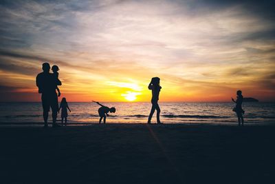 Silhouette family at beach