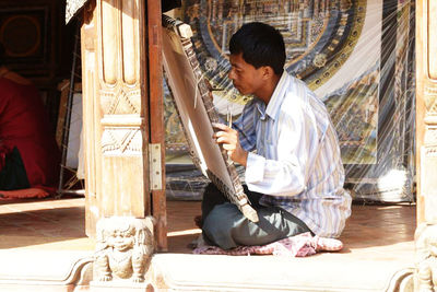 Man painting at workshop