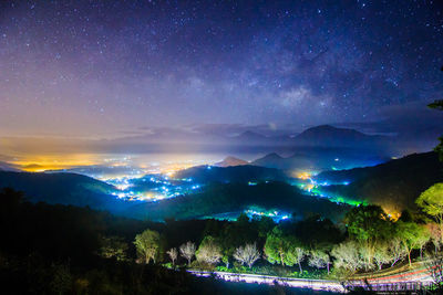 Scenic view of landscape against sky at night