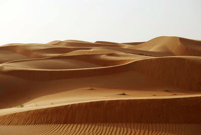 Scenic view of desert against clear sky