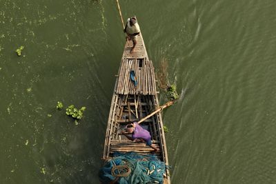 High angle view of man riding a boat 